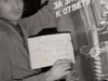 Moshe Averbuh with a Soviet anti-Semitic (anti-Israeli) poster. Leningrad, 1987 co RS