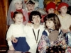 Purimshpiel in the Lifshitzs’ apartment. Lena Romanovsky with children in actors costumes before performance. Leningrad, 1984,  co RS