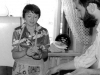 Farewell party of  Alexander and Lora Genusov family at their apartment. Lora Genusov and Daniel Romanovsky. Leningrad, 1981. co RS