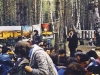 Jerusalem Day at Ovrazhki. The forest clearing was covered in decorations. In front of you are posters and post cards with views of our ancient capital. Those present have just finished hearing  Eliahu Essas who told of Jerusalem's history. Endless questions followed. After this part of the program there were songs in Hebrew, in Russian and in Yiddish. The younger generation asked for the Hebrew songs to be written out for them in Russian letters. When evening came, no one wanted to leave. Moscow, Ovrazhki forest, 1977. co RS