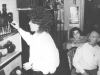 Hanukkah in the apartment of the Mendelev family. From the right: Oscar Mendelev, his wife Shelli and ?, lighting the Hanukkah candles. Moscow, beginning of 1980s, co RS
