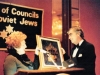 Lynn Singer hands in an award to ? at a meeting of the Union of Councils for Soviet Jews. USA, 19??. co RS