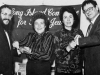 Lynn Singer and Carole Abramson show Yosef Mendelevich (left) and Sir Martin Gilbert (right) bracelets with names of Prisoners of Zion engraved on them. Israel, 1982. co RS